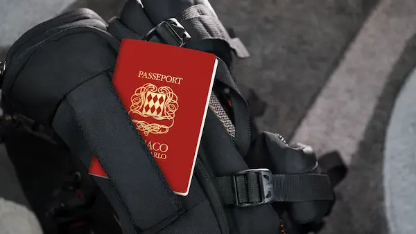 Monaco Passport on a Black Suitcase Travel Bag