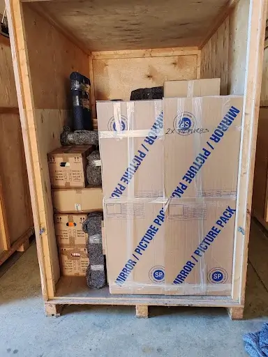 Packed removal boxes and items in a secure storage container