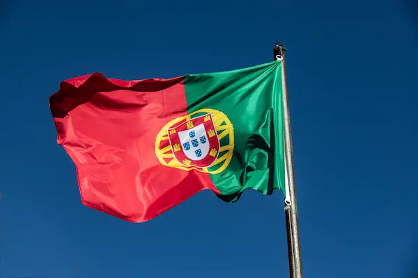 Portuguese flag and coastal landscape