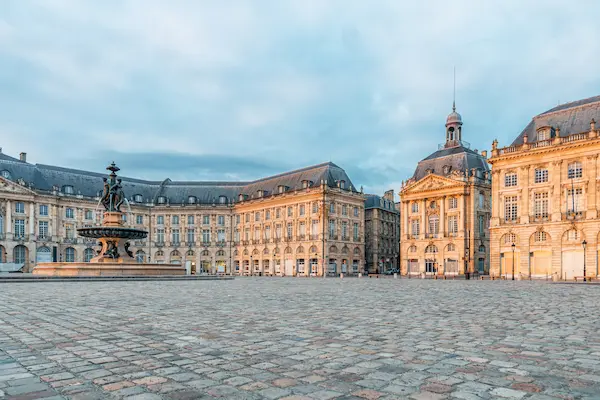 Place de la Bourse and Three Graces fountain historic square with classical architecture in Bordeaux city center — Gentlevan Removals UK to Bordeaux service
