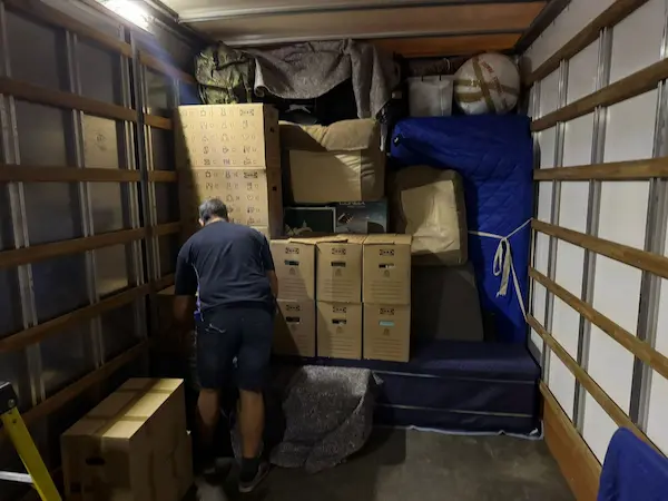 Household furniture and boxes ready for part-load removal to France