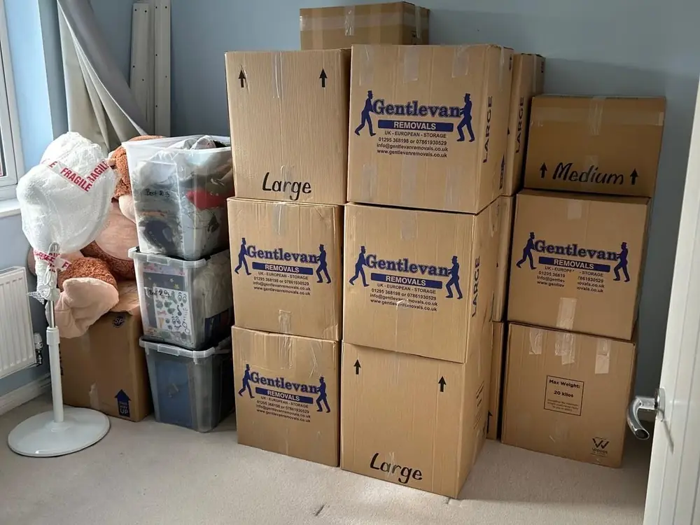 Gentlevan Removals cartons packed, taped and stacked in a bedroom ready for collection