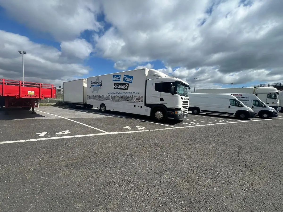 Gentlevan Removals road train, lorry and drawbar trailer, parked alongside a Gentlevan van in a marked commercial vehicle park